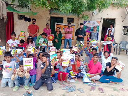 Amarpushp team distributing school bags and stationery to students
